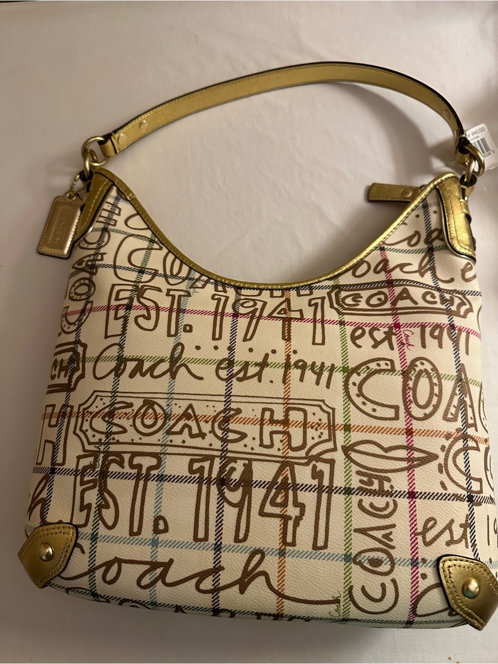 Coach Multicolor Logo Coated Canvas Shoulder Bag with Gold leather Accents. NWT